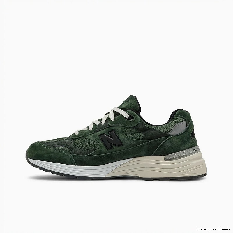 New Balance retro-style dark green running shoes